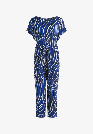 Blue jumpsuit with black and white abstract zebra stripes, short sleeves, and a matching fabric belt at the waist.