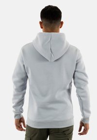 Felpa grigia chiara con cappuccio regolabile, polsini e orlo a costine. Tessuto morbido, con un design semplice e privo di decorazioni.