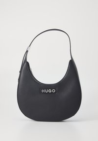 Black leather shoulder bag with a half-moon shape, featuring a prominent silver "HUGO" logo and a sleek, minimalist design.
