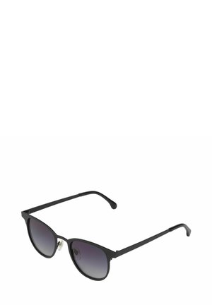 Lunettes de soleil style œil de chat en métal noir avec des verres dégradés, des branches fines et des plaquettes de nez pour le confort. Design minimaliste avec une finition épurée.