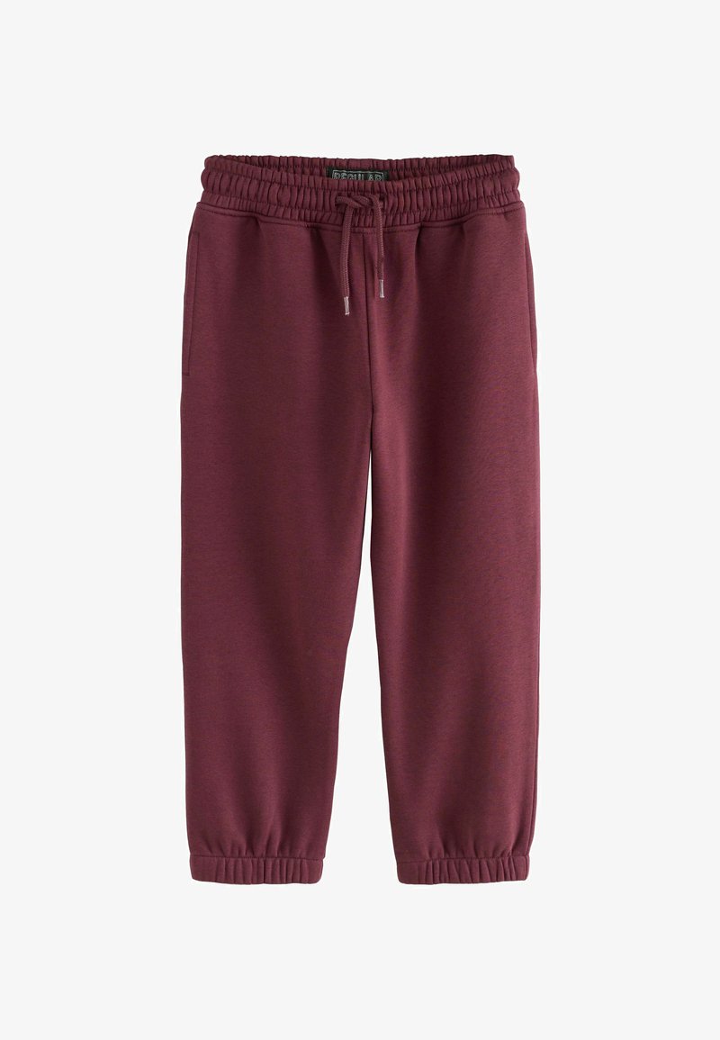 Bordeaux jogger broeken met elastische tailleband en trekkoord, zijzakken en elastische mouwen, plat gelegd op een witte achtergrond.