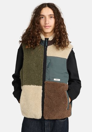 Fleece vest with a color-block design in green, beige, and brown. Features zip closure, patch pocket, and textured fabric throughout.