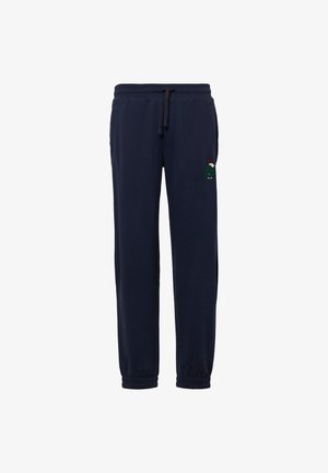 Donkerblauwe joggingbroek van zacht materiaal, met een elastische tailleband met trekkoord en elastische boorden. Voorzien van een kleine geborduurde karakterdetail.