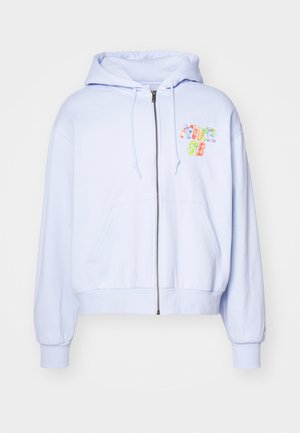 Light blue zip-up hoodie made from soft fabric, featuring a front pocket, elastic cuffs, and a colorful embroidered logo on the chest.