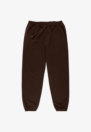 Brązowe dresy wykonane z miękkiego materiału, z elastycznym paskiem w talii z sznurkiem, bocznymi kieszeniami oraz zwężanymi mankietami przy kostkach.