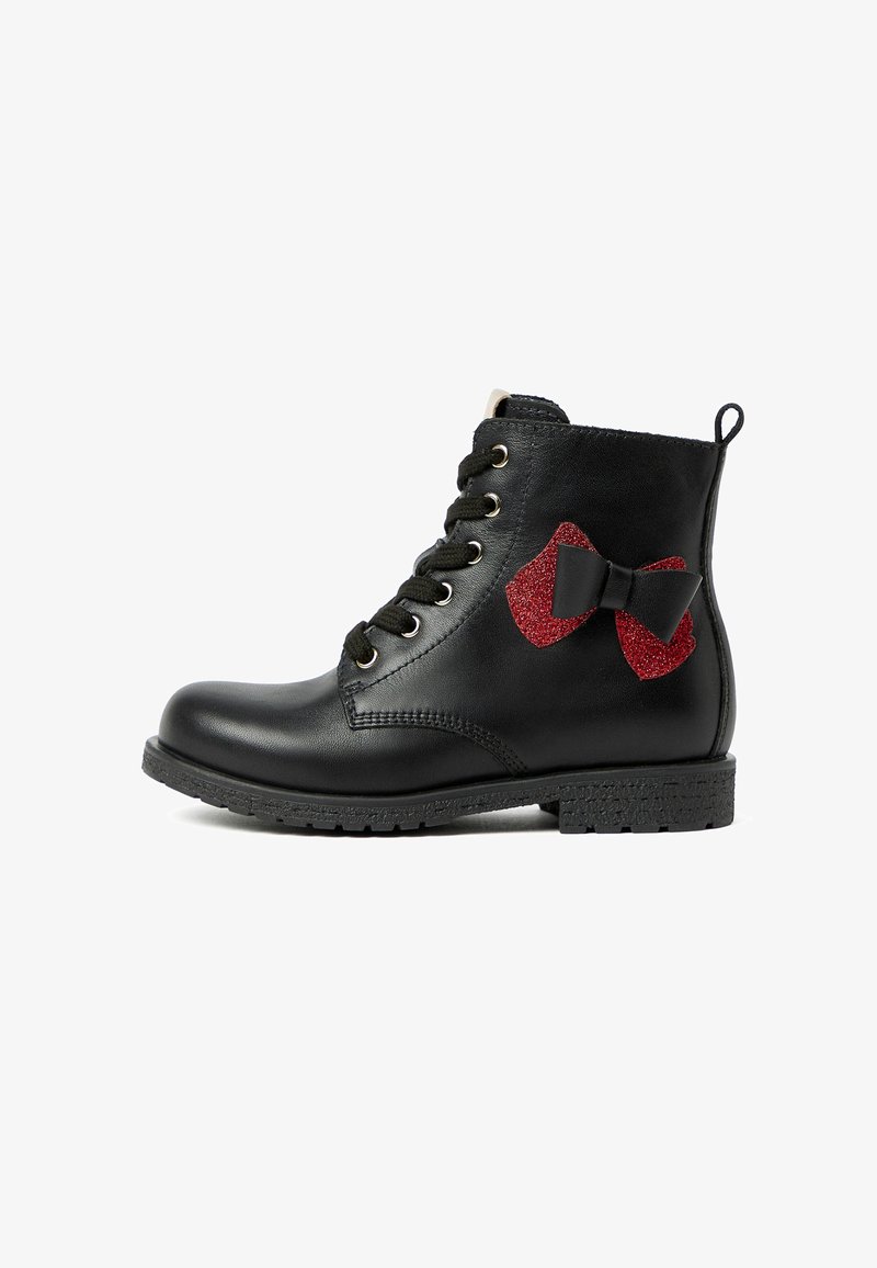 Black leather ankle boot with black laces, a textured rubber sole, and red glittery bow accents on the side. Design includes metal eyelets.