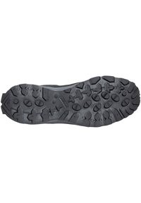 Black hiking shoe sole with deep, multi-directional treads for enhanced grip and durability on rugged terrain.