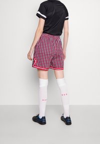 Nike Performance Sportovní kraťasy - red