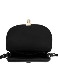 Black leather crossbody bag open, showing a single main compartment with gold-tone clasp and adjustable strap ends.