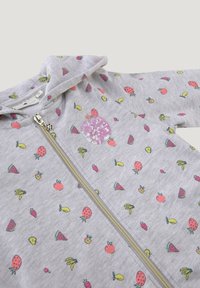 Šedá mikina na zip s potiskem ovoce, včetně jahod, banánů a melounů. Obsahuje detaily z flitrů v kulatém designu.