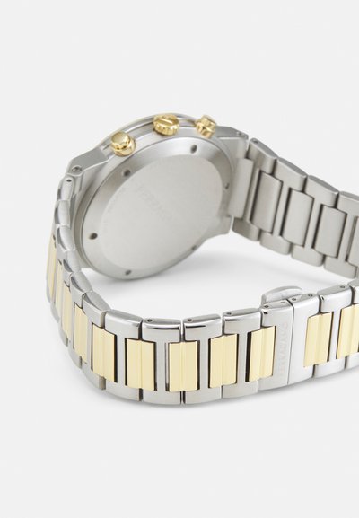 Silver and gold-tone metal watch with a three-link bracelet; features three yellow-gold pushers and a brushed silver case back.
