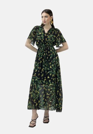Robe maxi en tissu noir transparent avec un motif de feuilles vertes et de fleurs jaunes, manches courtes à volants, taille cintrée et une silhouette fluide et décontractée.