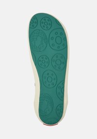 Suola di scarpa con una texture in gomma verde chiaro, caratterizzata da un motivo di forme circolari e un design a globo. Bordo laterale avorio e accentuazione rossa.