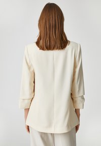 Koton 3/4 SLEEVE POCKET DETAIL - Kort kappa / rock - ecru
