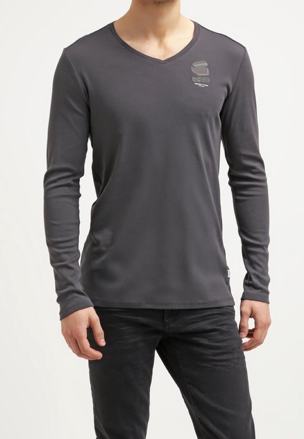 Gray long-sleeve T-shirt with a V-neck, made from smooth fabric; features a small logo on the chest and a fitted design.