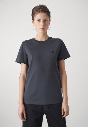 Dark gray cotton T-shirt with short sleeves, round neckline, and a small triangular logo on the left chest. Smooth texture, relaxed fit.