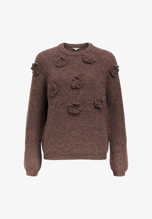 Pruunilõngast kootud sviiter tekstuursete lilledega aplikaadidega, ümmargune kaelus ja pikad varrukad. Pehme materjal, mis näeb välja mugav.