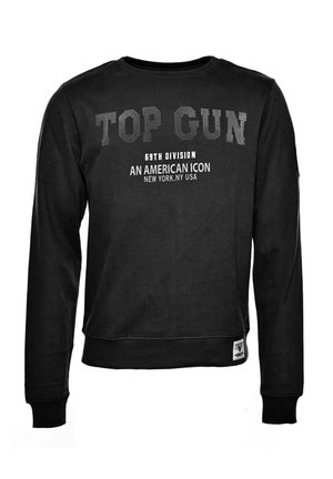 Czarna bluza o klasycznym kroju, z białym napisem: "TOP GUN", "69th DIVISION" oraz "AN AMERICAN ICON". Prążkowane mankiety i dół. Miękka faktura.