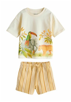 Cream short-sleeve shirt with toucan, elephant, and leopard design paired with yellow and white striped drawstring shorts.