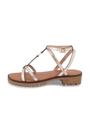 Sandalo con cinturini con tomaia in metallo rosa chiaro e suola marrone. Presenta una chiusura con fibbia e suola testurizzata per una migliore trazione.