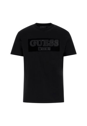 Czarna bawełniana koszulka z dużym, teksturowanym logo GUESS z napisem "EST. 1981" poniżej, okrągłym dekoltem i krótkimi rękawami.