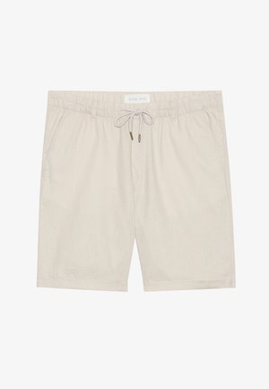 Beige linen shorts with an elastic waistband, drawstring closure, and two side pockets. Smooth texture and relaxed fit design.