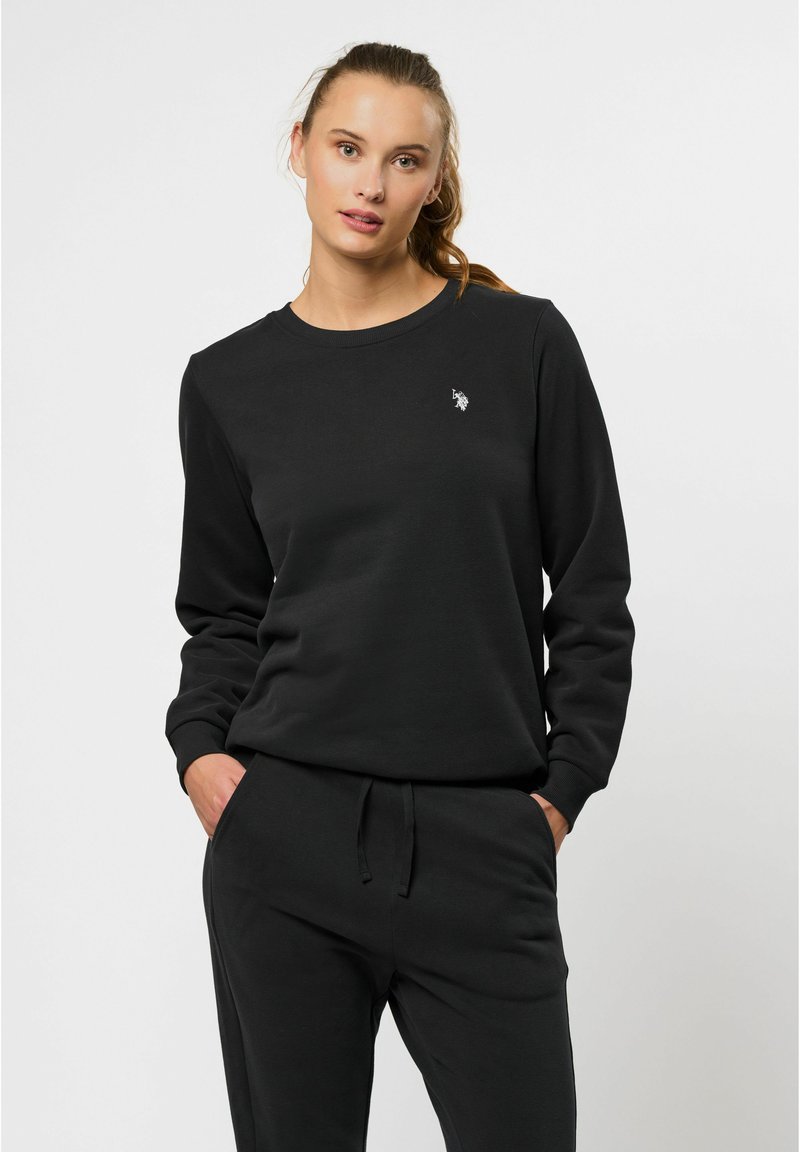 Zwarte sweatshirts gemaakt van zachte stof met een ronde hals, lange mouwen en een klein logo accent op de borst. Casual, ontspannen pasvorm.