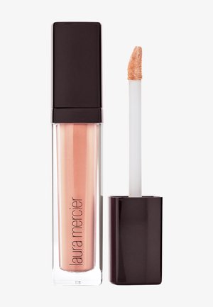 Laura Mercier lipgloss i en klar tube med firkantet topp, som viser en fersken-nude farge og en doe-foot applikator.
