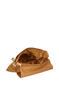 Borsa in canvas marrone con una texture morbida, dotata di un interno spazioso, foderatura in tessuto leggero e chiusura con zip. Cinghia regolabile inclusa.