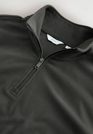 Pullover zip-up nero realizzato in tessuto morbido e testurizzato con colletto a sacchetto. Presenta una zip visibile e un'etichetta con la scritta "NEXT".