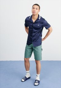 Dickies DUCK CARPENTER - Shorts - dark forest