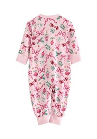 Pink baby onesie featuring a colorful holiday pattern with ribbons, ornaments, berries, and greenery. Long sleeves and cuffed ankles.