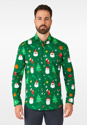 Grøn langærmet skjorte med festligt print, der forestiller julemandens ansigt, juletræer, pynten og stjerner. Lavet af glat, letvægtsstof.
