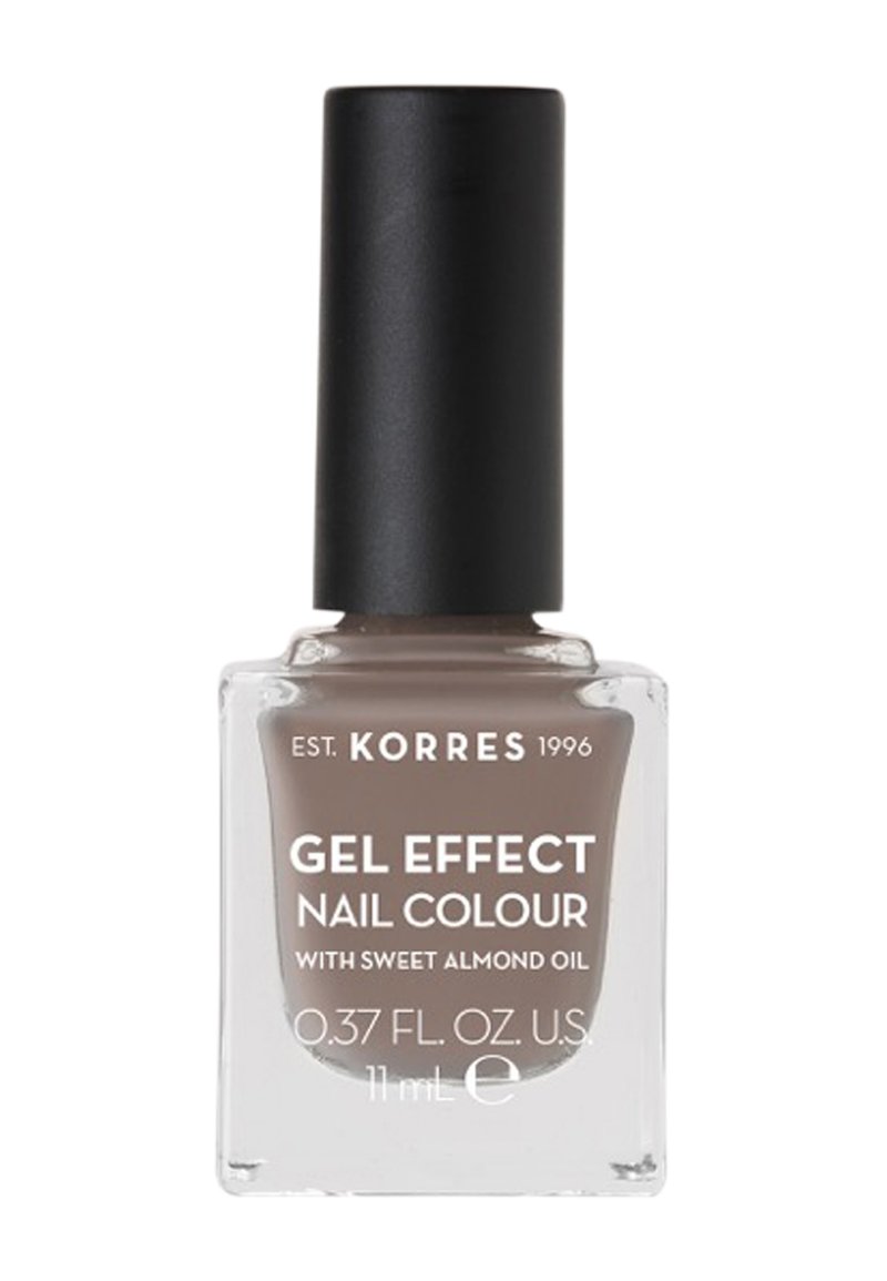 Smalto effetto gel marrone in una bottiglia quadrata trasparente con tappo nero. Contiene olio di mandorle dolci. Volume: 11 ml (0,37 fl. oz).