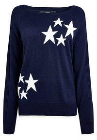 Pull-over à manches longues bleu marine avec motifs d'étoiles blanches sur la partie supérieure gauche de la poitrine et le bas droit, poignets et ourlet côtelés.