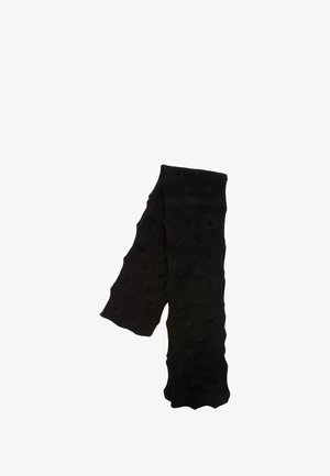 Sciarpa nera lavorata a maglia con trama, piegata in modo morbido su uno sfondo bianco.