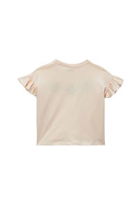 Chemise à manches courtes, couleur pêche claire, avec des accents volantés sur les manches et un col rond. Matériel en coton doux, design simple, sans embellissements.