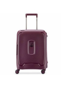Hard-shell carry-on suitcase in deep burgundy with a textured surface, retractable handle, and four swivel wheels for easy maneuverability.