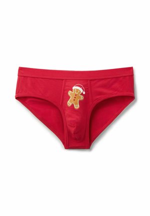 Červené bavlněné boxerky s grafikou perníkového mužíka s vánoční čepicí, s detaily v béžové, červené a bílé barvě. Hladká textura.