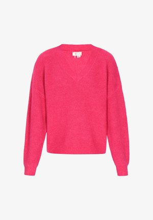 Ryškiai rožinė megzta palaidinė su ilgomis rankovėmis ir V formos apykakle, pateikta prieš baltą foną.