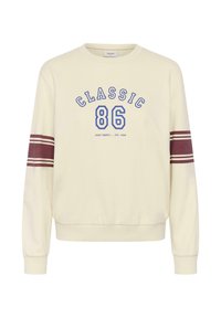 Sudadera de color crema con el texto azul "CLASSIC" y "86", con acentos a rayas color marrón en las mangas y puños y dobladillo acanalados.