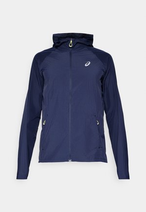 Navy blue hooded jacket made from lightweight material, featuring a full zipper, side pockets, and contrast yellow accents.