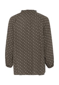 Blouse brune à pois avec un col froncé, des manches longues et une coupe décontractée, présentant des pois blancs sur un tissu texturé.