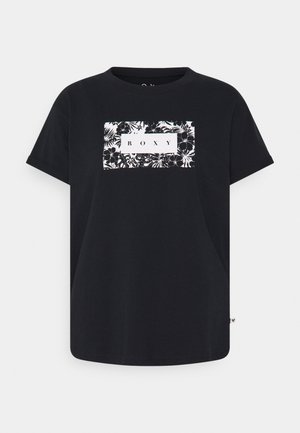 T-shirt en coton noir avec un col rond, présentant un logo rectangulaire blanc "ROXY" entouré de motifs floraux en noir et blanc.