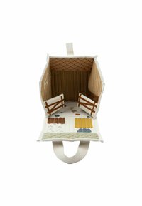 Quilted fabric toy bag with a barn design, featuring brown wood accents, a textured roof, and colorful embroidered patterns on a cream background.