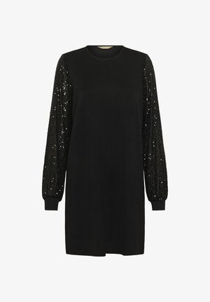 Robe noire avec un col rond et des manches longues. Les manches présentent une texture pailletée, tandis que le corps est lisse et d'une coupe décontractée.