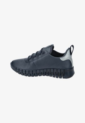 Navy blue sneaker made of textured leather, featuring a chunky rubber sole with cutouts, round toe, and a silver accent at the heel.