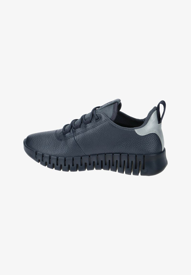 Navy blue sneaker made of textured leather, featuring a chunky rubber sole with cutouts, round toe, and a silver accent at the heel.