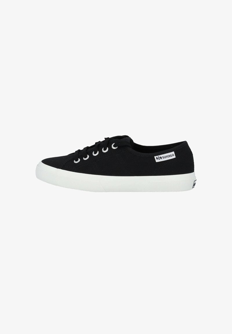Black canvas sneaker with white rubber sole, round toe, and lace-up design. Brand label on side displays "SUPERGA." Minimalist style.