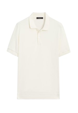 Polo crème clair en tissu doux, avec col classique, patte à deux boutons et manches courtes. Texture lisse ; design minimaliste.